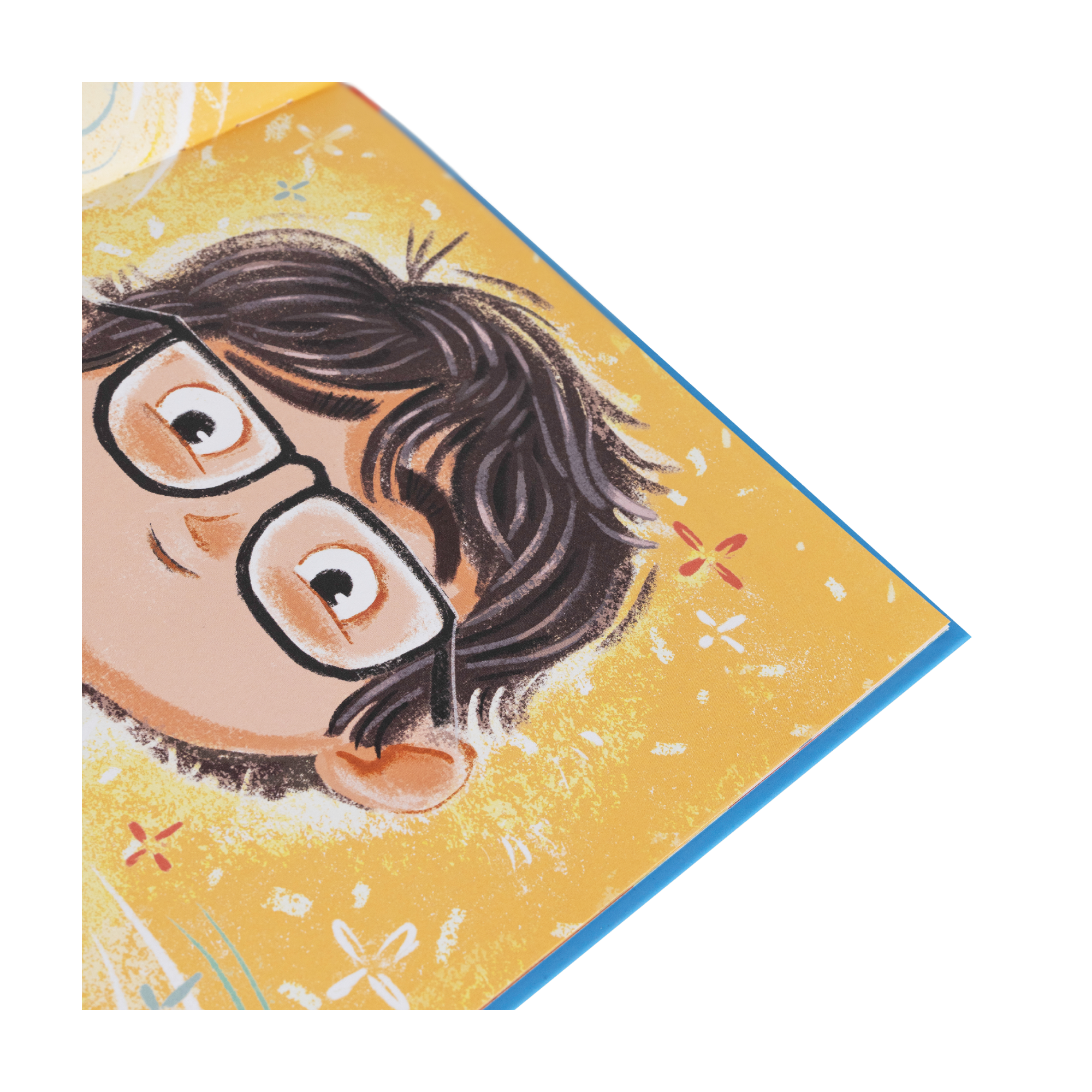 Illustration eines Kindes mit Brille und dunklen Haaren auf gelbem Hintergrund mit kleinen Blumen, die auf der Ecke eines aufgeschlagenen "Du schaffst das!"-Buchs von Jessica Sanders zu sehen ist.