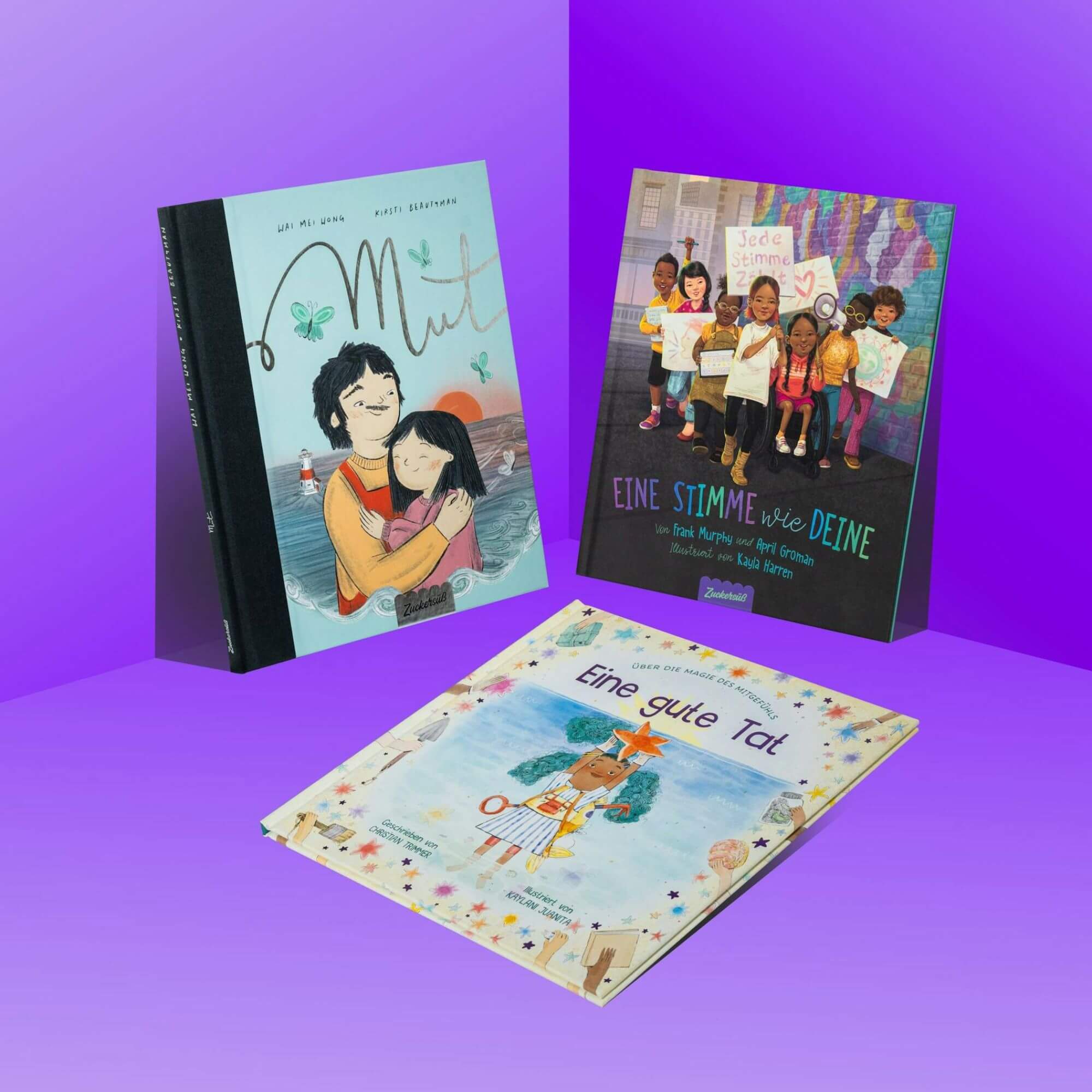 "Das Optimismus-Paket" von Zuckersüß Verlag zeigt drei aufrecht stehende, überlappende Bilderbücher mit farbenfrohen Covern voller vielfältiger Charaktere vor violettem Hintergrund.