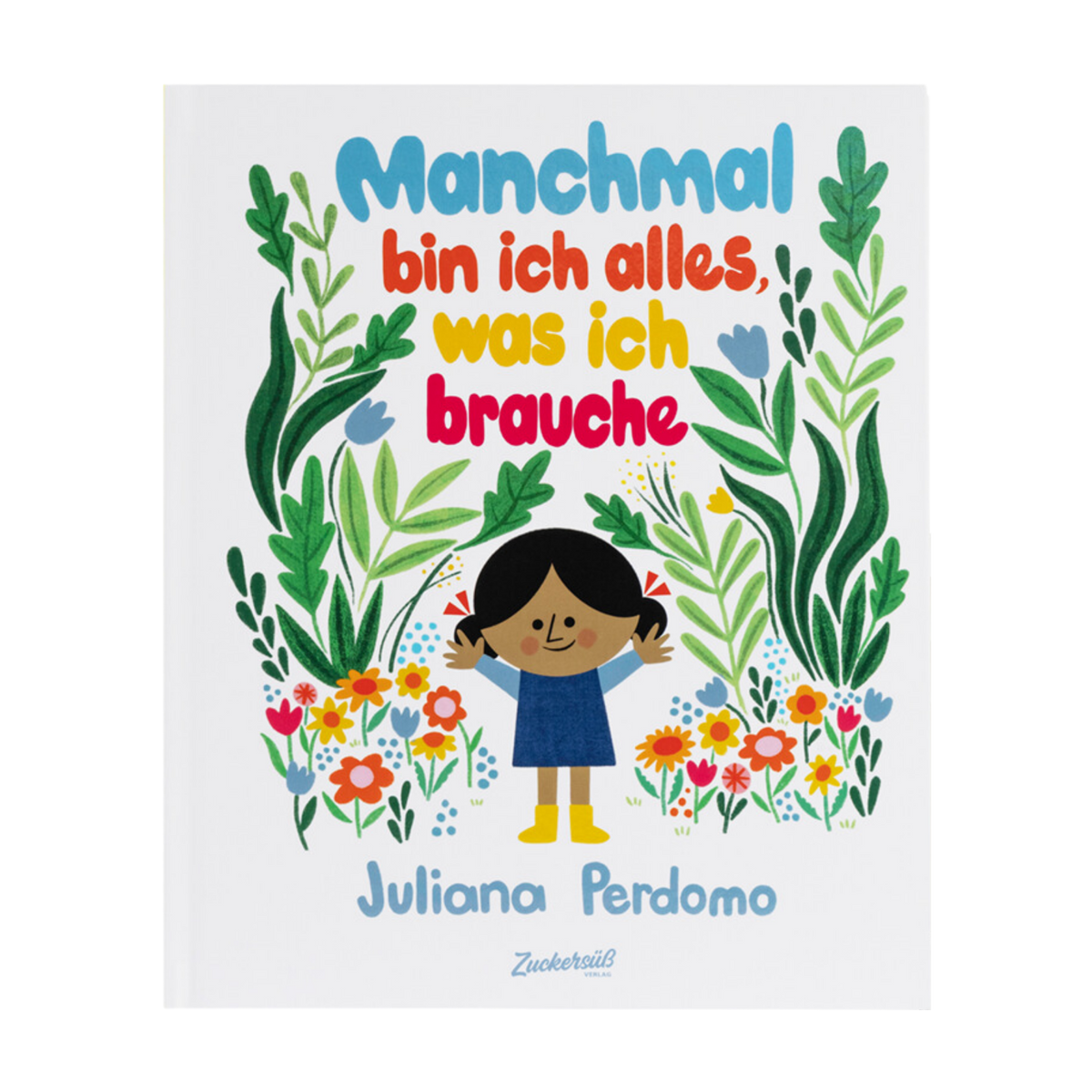 Das Cover des Kinderbuchs „Manchmal bin ich alles, was ich brauche“ von Juliana Perdomo zeigt ein lächelndes Kind mit dunklen Haaren in einem blauen Kleid, das zwischen bunten Blumen und grünen Pflanzen steht. Darüber ist der farbenfrohe Titel in großen Buchstaben zu lesen.